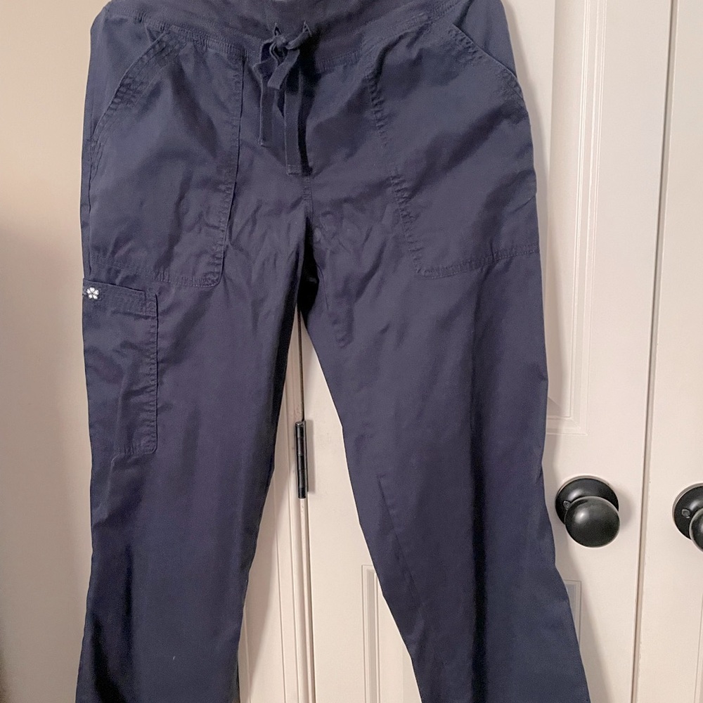 Pair of koi navy blue scrubs. Used but in good condition.Small petite pants.